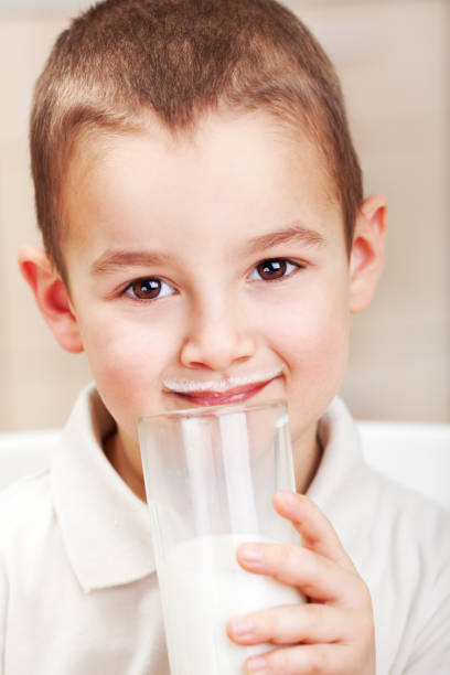 istock Little boy drink milk 1369149816