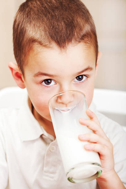 istock Little boy drink milk 1369149841