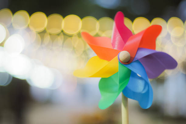 istock Colorful pinwheel with golden bokeh background 1369151015