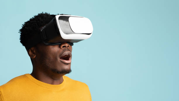 istock Amazed young black man having virtual reality glasses experience, closeup 1369151838