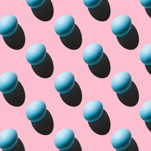 istock The pattern of their blue eggs with a hard shadow arranged diagonally on a pink background 1369152813