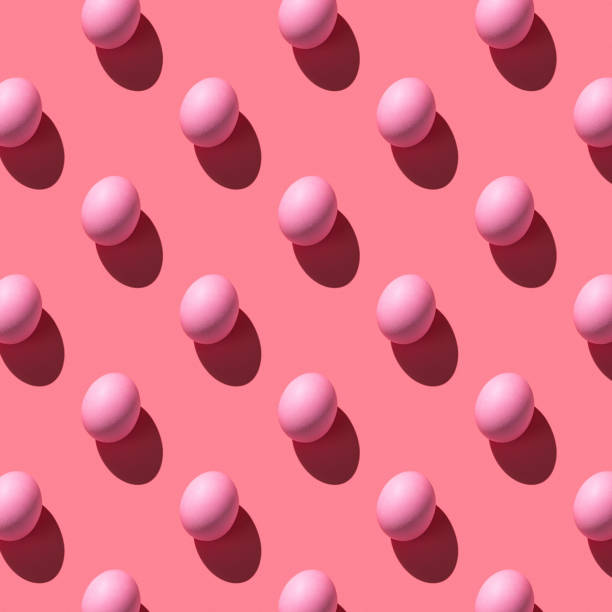 istock Patteron of pink Easter eggs with a hard shadow 1369154153