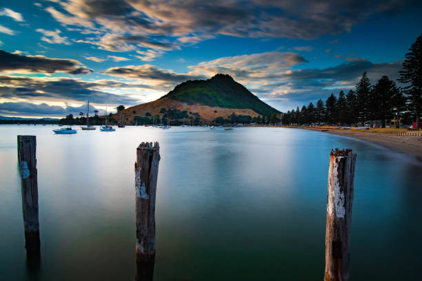Long exposure of Mount Maunganui taken from Pilot Bay Beach Mount Maunganui an extinct Volcano is viewed from Pilot Bay Beach. mount maunganui stock pictures, royalty-free photos & images