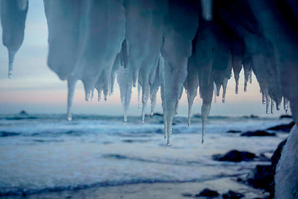 Icicles under a rock near the Pacific ocean in Kamchatka