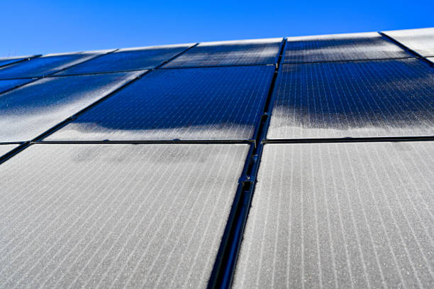 solar panels on barn roof with frost on - non polluting imagens e fotografias de stock