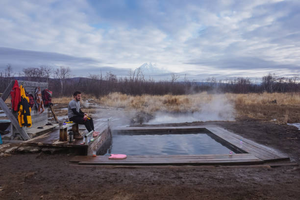 istock A guy in a natural thermal spring in Kamchatka 1369156377