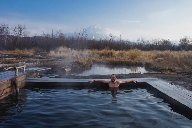 istock A guy in a natural thermal spring in Kamchatka 1369156689