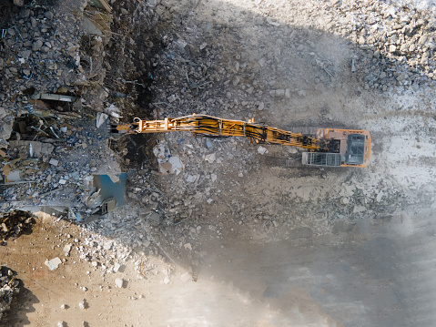 Excavator with Hydraulic Shears in action