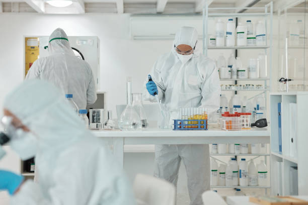 istock Shot of a scientist wearing a radiation suit while working with samples in a lab 1369159141