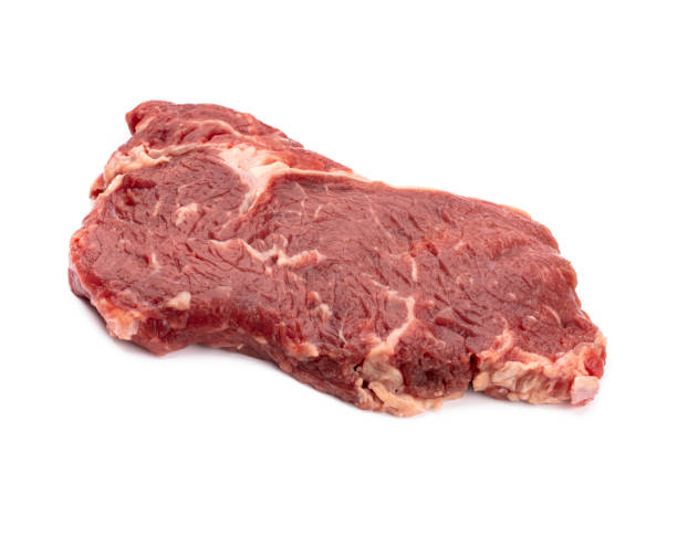 istock Fresh raw  steaks isolated on white background................. 1369160853