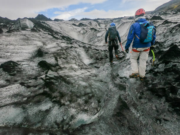 istock Two men walking on glacier, Iceland 1369163098