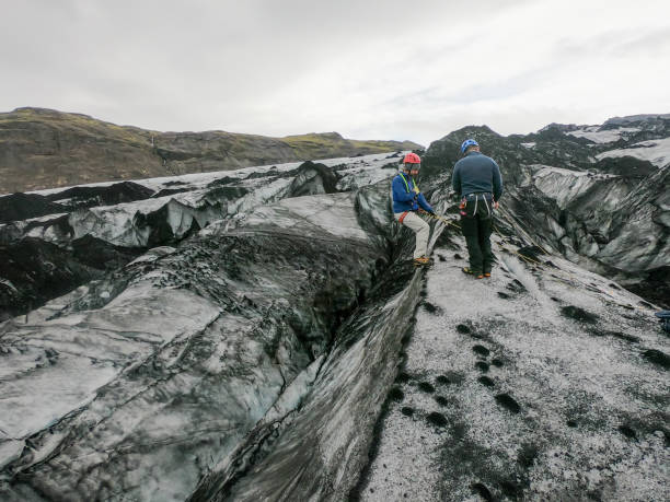 istock Two men practicing climbing up crevasse in glacier, Iceland 1369163143