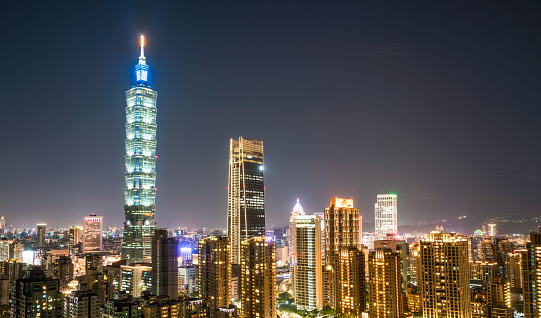 A night shot of Taipei's downtown area, with Taipei 101 at left, and the city's second tallest building, Nan Shan Plaza in the centre of the image.