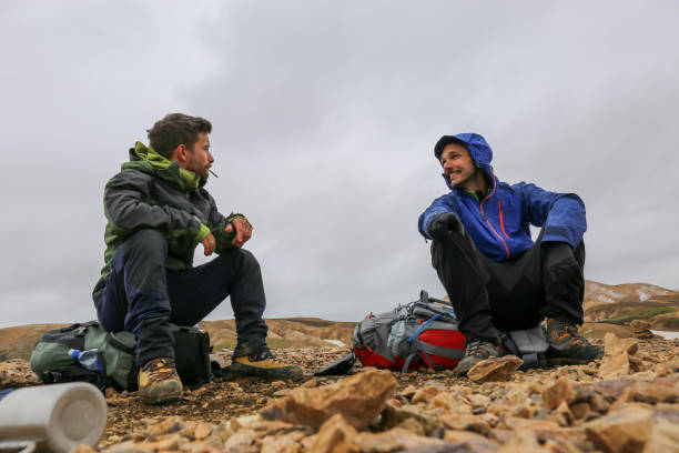 istock Two backpackers resting on the trekking journey in Iceland 1369163941