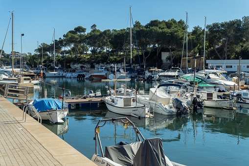 Portopetro, Spain; january 27 2022: Marina in the Mallorcan town of Portopetro, with yachts and boats moored on a sunny morning. Spain