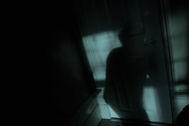 istock Creeping Shadow Figure in the Moonlight 1369164388