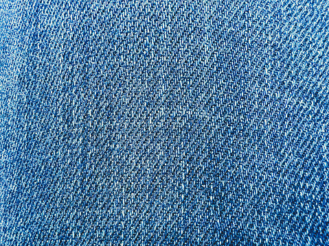 A blue jeans fabric as a background or texture.