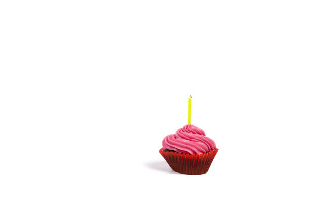istock Cupcake with candle isolated on a white, Birthday cake on a white with copy space. 1369164637