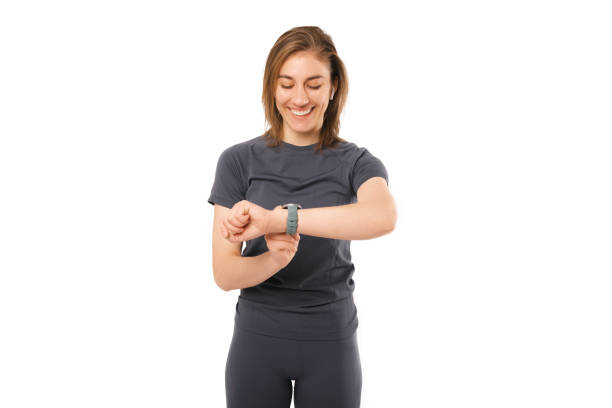 Photo of young fitness sport woman using smartwatch to monitoring heart rate stock photo
