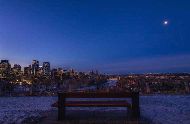 Bench Looking Out Over A Nighttime City stock photo