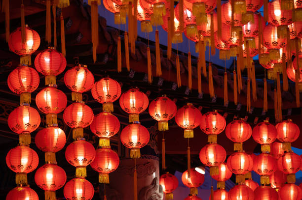 istock Rows of colorful glowing red Chinese lanterns 1369166028