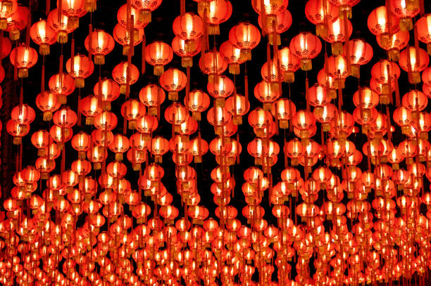 istock Rows of colorful glowing red Chinese lanterns 1369166051