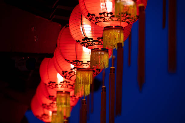 istock Rows of colorful glowing red Chinese lanterns 1369166063