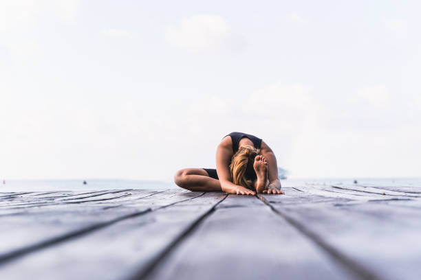 istock Healthy woman training on seaside promenade. 1369166228