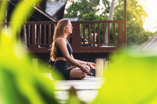 istock Outdoor meditation and yoga practice at sunset or sunrise. 1369166319