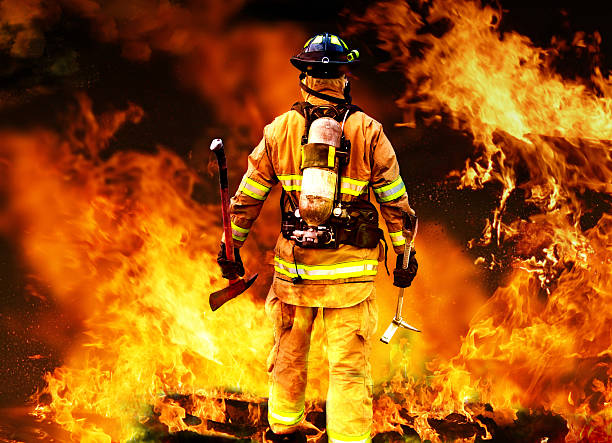 Into the fire Firefighter searching for possible survives. firefighter stock pictures, royalty-free photos & images