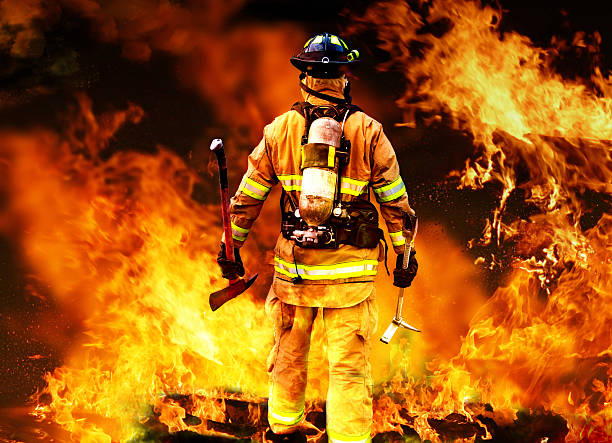 Into the fire Firefighter searching for possible survives. rescue stock pictures, royalty-free photos & images