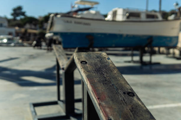 wooden tripods to support a boat - industrial ship shipping painting repairing imagens e fotografias de stock