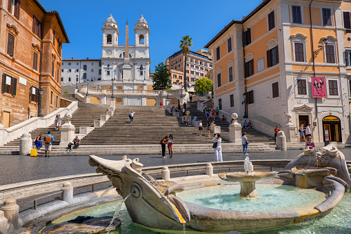 Rome, Italy - September 8, 2020: Spanish Steps and Barcaccia Fountain on Piazza di Spagna city square.