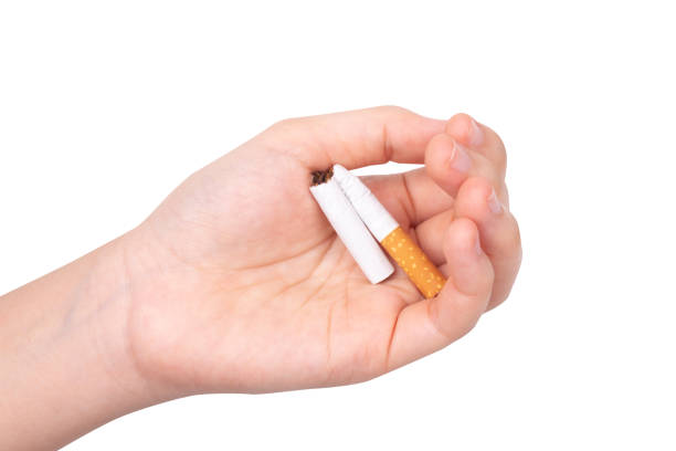 istock cigaret  woman hand isolated on white background 1369169924