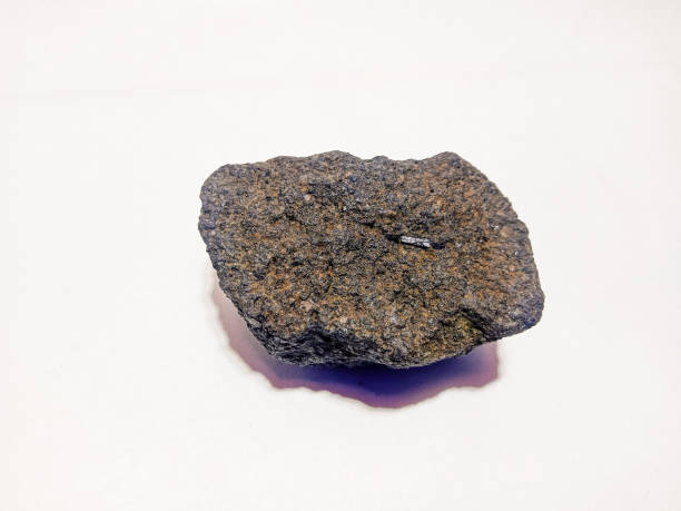 istock a stone that I found in my yard, on a white background 1369170322