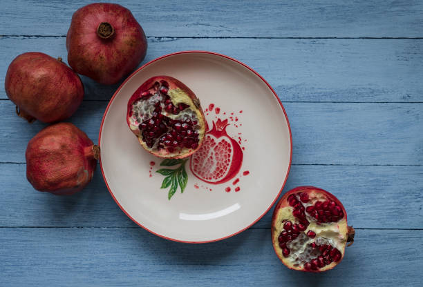 Ripe pomegranate fruit on wooden background