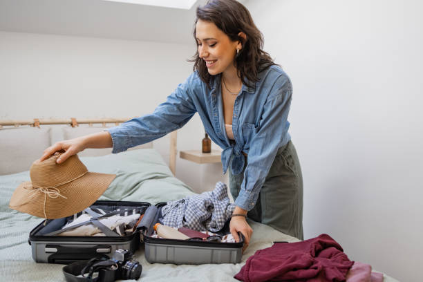 istock Woman packing suitcase for a vacation 1369172127