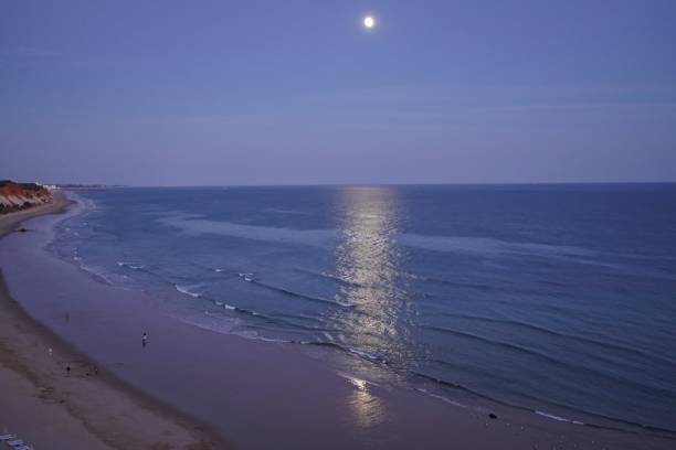 istock Night seascape with coming moon in Algarve. 1369173268