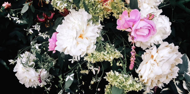 istock Bouquet with peonies, roses, hydrangea and lily in the garden 1369173397