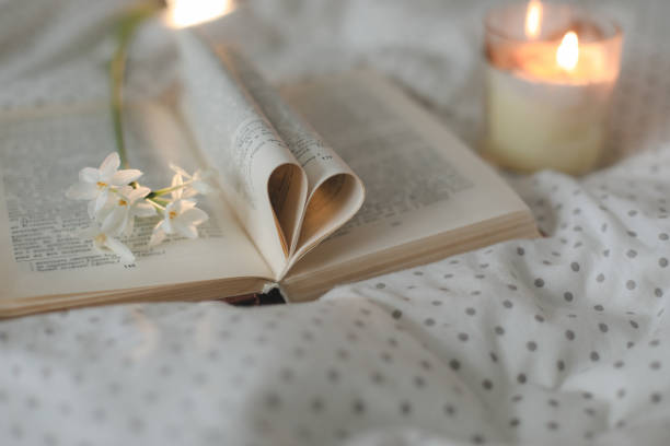istock Book with pages folded into a heart shape. valentine's festive background 1369174015