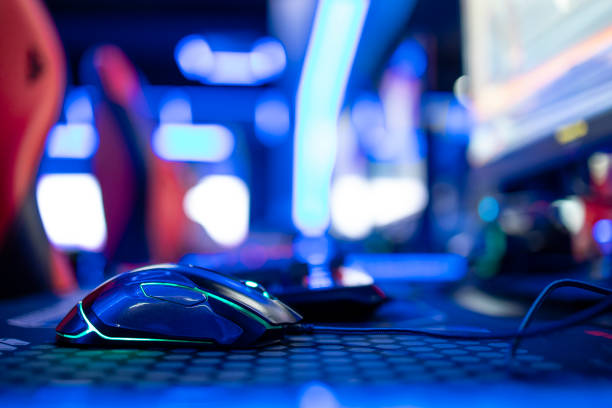 istock Close up view of computer mouse in video game room. Entertaining industry. 1369174054