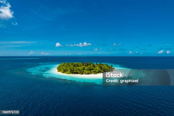 Isolated Tropical Island Middle Of Ocean Stock Photo - Download Image Now - Maldives, Island, Tropical Climate