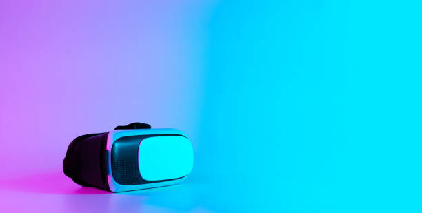 istock VR headset virtual reality. 3d digital glasses on futuristic neon tech background. Innovation device, cyberspace technology. 1369176625