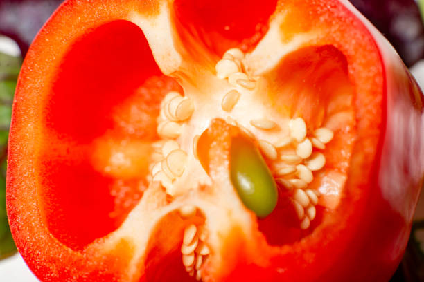 Collection of red and yellow bell peppers in vibrant color.