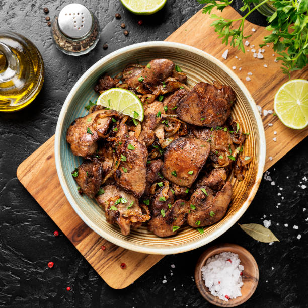 Fried chicken liver with onions and herb Fried chicken liver with onions and herbs. top view sauteed stock pictures, royalty-free photos & images