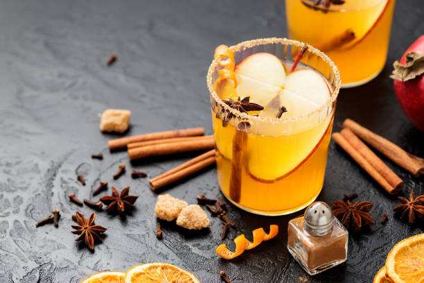 istock Hard apple cider spiced cocktail with sliced red apples 1369179686