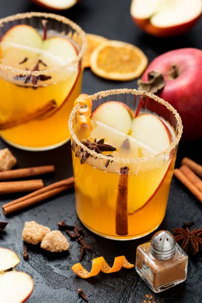 istock Hard apple cider spiced cocktail with sliced red apples 1369179688