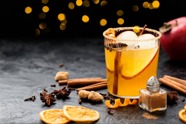 istock Hard apple cider spiced cocktail with sliced red apples 1369179693