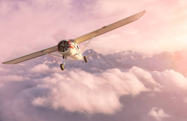 istock Single Engine Airplane Flying over the Rocky Mountain Landscape 1369181118