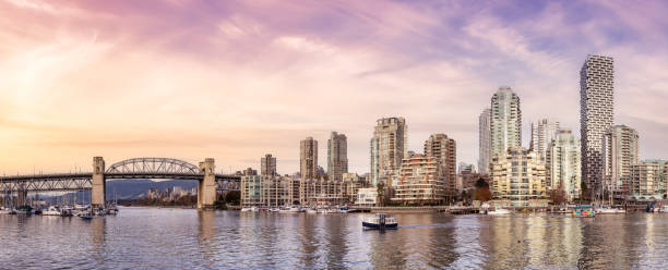 Panoramic View of boats in a marina and Modern Downtown Cityscape Panoramic View of boats in a marina and Modern Downtown Cityscape. Sunset Sky Art Render. Vancouver, British Columbia, Canada. false creek stock pictures, royalty-free photos & images